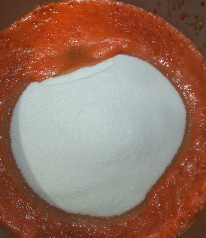 Add sugar to pureed peppers